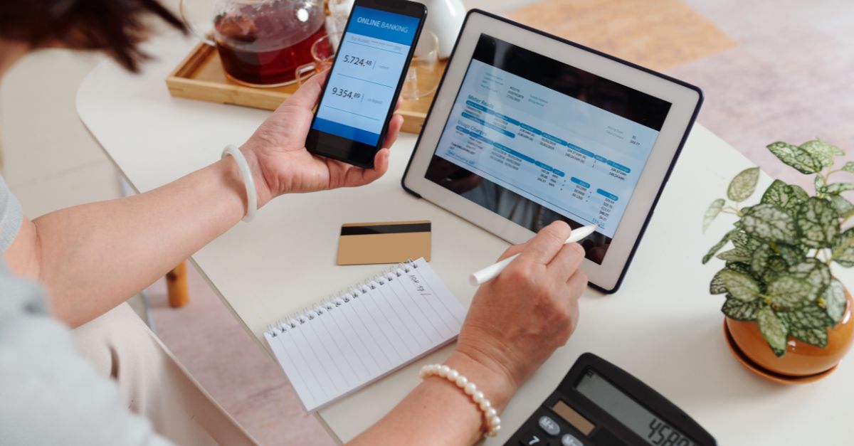Childcare directors desk with Ipad, calculator, and notebook for organizing tax receipts.