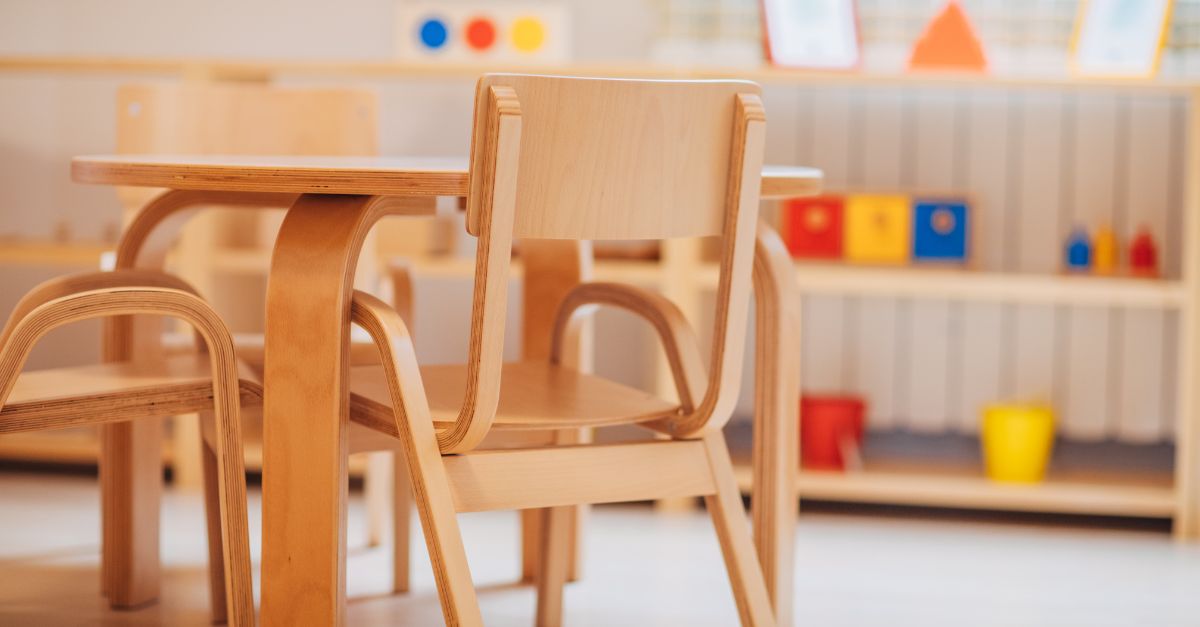 Photo of wooden chair and tables in preschool classroom