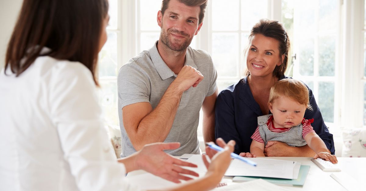 Family with infant at a meeting with their childcare center director