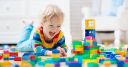 Preschool boy playing with lego