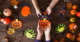 Halloween craft table that children are playing with