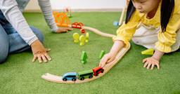 Preschoolers engaging in play based learning and developing problem solving skills