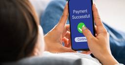 Parent of a child in daycare making a successful childcare payment from their phone. 