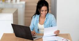 Childcare director tracking tuition on their computer 