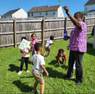 Teacher outside with group of children