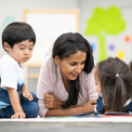 educator with children in classroom