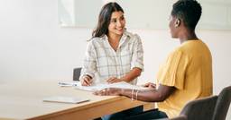 A new Early Childhood Educator sitting down with their mentor 