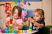 Children building towers with wooden blocks