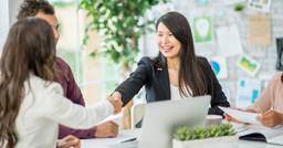 Early childhood educator and mom shaking hands 