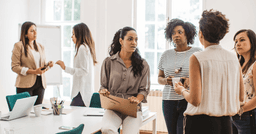 A group of early childhood educators mingling before a professional development training session