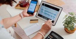 Childcare director using technology to organize tax receipts and tuition payments from families