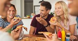 A group of educators enjoying a pizza lunch 