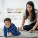 teacher and child crawling