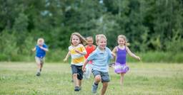 Preschoolers running in open field