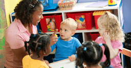 An ECE on the first day working to create classroom routines