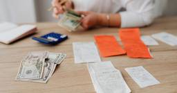 Childcare director organizing receipts and tuition payments