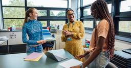 Three early childhood educators talking to eachother and ensuring the others are not experiencing burnout 