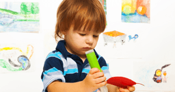Toddler freely exploring their interests